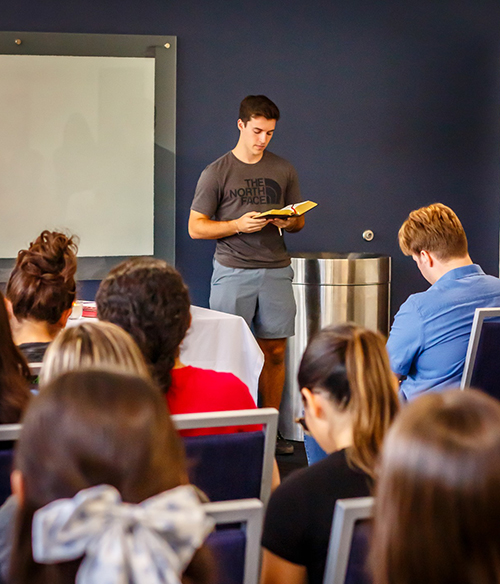 FOCUS missionary Thomas Benson lectors during on-campus Mass Oct. 30, 2024 at the Florida International University Graham Center in Miami.