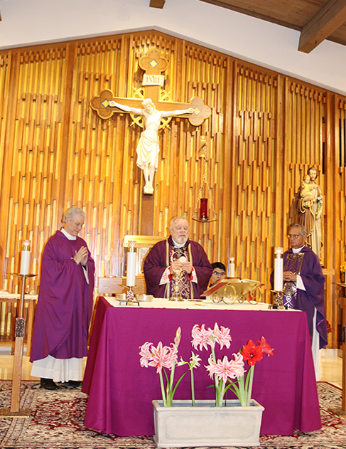 Archbishop Thomas Wenski celebrates the Mass of rededication on Dec. 8 of St. Matthew Church in Hallandale Beach following restoration of the sanctuary to its original mid-century modern sacred design. Concelebrants are pastor Father Lazarus Govin, left, and Msgr. Franklyn Casale.