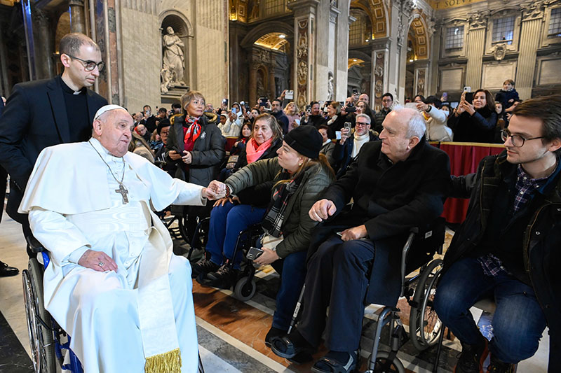 Pope Francis greets people at the conclusion of Mass in St. Peter's Basilica at the Vatican Jan. 1, 2025, the feast of Mary, Mother of God, and World Peace Day.