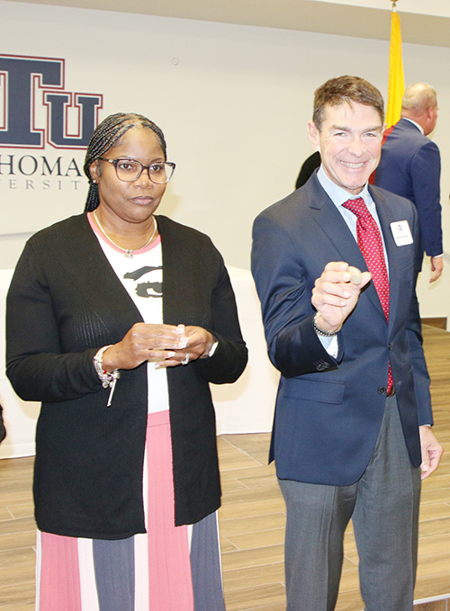 Catholic school educators Emetrail Norris Burton, left, and Manuel Sainz Llama are among 11 teachers who will begin the second cohort to earn a master's degree in educational leadership for Catholic education at St. Thomas University in Miami Gardens. They received a welcome and stone with a word of encouragement at a reception held Jan. 10, 2025 at St. Thomas.