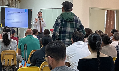 Attorney Joe Kano, of the Archdiocese of Miami's Catholic Legal Services, answers questions from an attendee during an immigration information session at Corpus Christi Parish in Miami, Jan. 15, 2025.