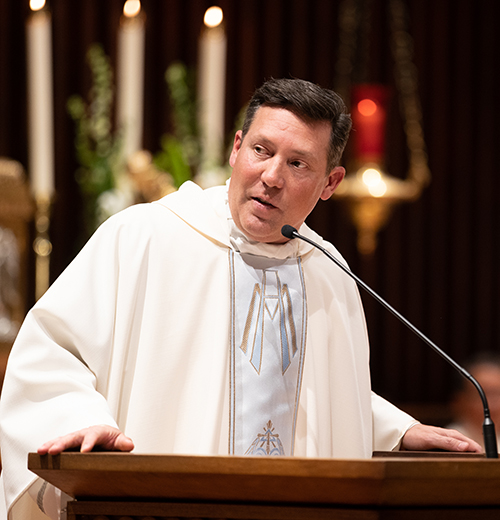 Father Richard Vigoa, pastor of St. Augustine Church and Catholic Student Center in Coral Gables and chaplain of the Legatus Miami Chapter, speaks to parishioners during a Mass celebrated at his parish in March 2022.
