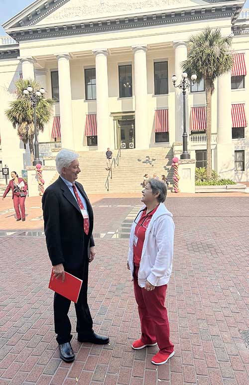 Ed Suazo, a member of Our Lady of Lourdes Church, Miami, talks with fellow Miami delegate Catherine Donn in front of the historic Florida Capitol building now housing the Florida Historic Capitol Museum on March 19, 2025 at the Catholic Days at the Capitol. Over 30 advocates travelled from the Miami Archdiocese to lobby for Catholic priorities during the state’s legislative session.