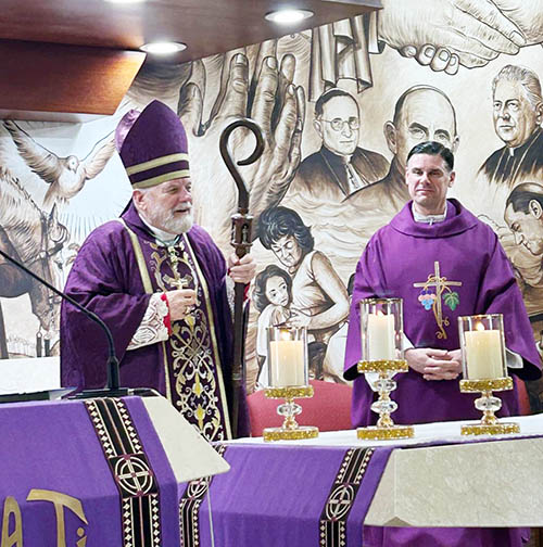 Archbishop Thomas Wenski celebrates Mass at the Día del Envío de los Movimientos Apostólicos Hispanos on March 15, 2025 at the National Shrine of Our Lady of Charity in Miami. To the right is concelebrant Father Rafael Capó, vice president of mission at St. Thomas University in Miami Gardens.
