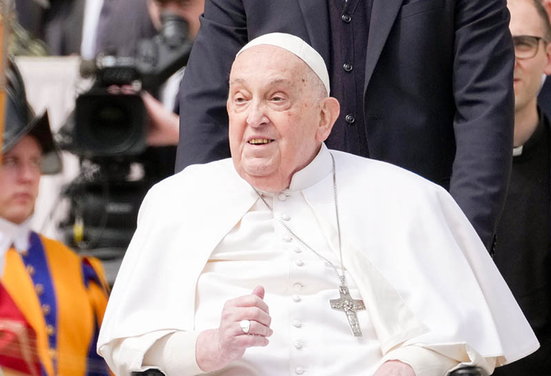 Pope Francis greets the faithful as he makes a surprise appearance in St. Peter's Square at the end of Palm Sunday Mass at the Vatican April 13, 2025.
