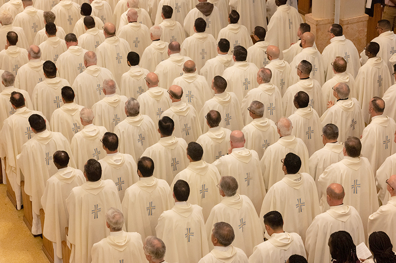 A view from the choir loft at St. Mary Cathedral shows archdiocesan priests in prayer during the Chrism Mass celebrated on April 15, 2024.