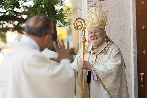 Archbishop Thomas Wenski Greets Priests as They Enter St. Mary's Cathedral for Chrism Mass April 15, 2025