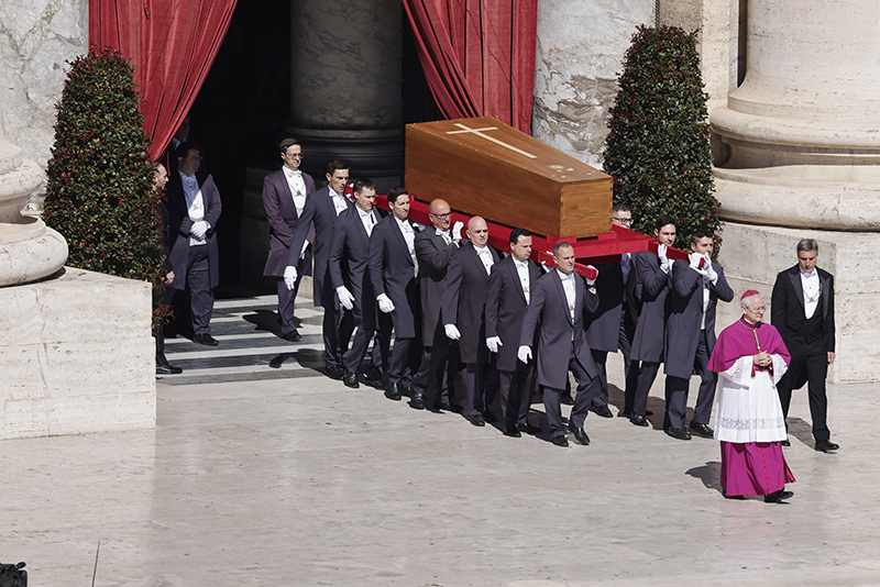 Fourteen pallbearers carry Pope Francis in his casket into St. Peter's Square for his funeral Mass April 26, 2025.