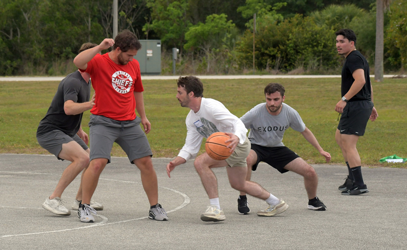 Campers grab a game of basketball during "Faith, Reality and the Great Outdoors," a young adult retreat in Davie May 3-4, 2025.