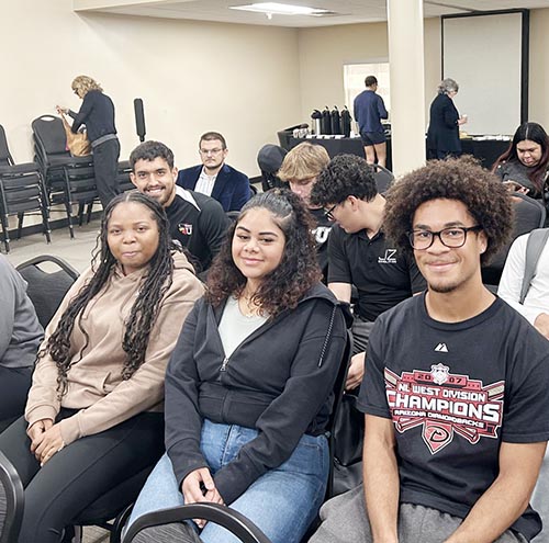 From left, Barry University students Jayden Byard, Nicole Rodriguez Paulino and Mikayla Weddeerburn attend the Barry University Institute for Immigration Studies 2nd Annual Conference on April 9-10, 2025 in Miami Shores.