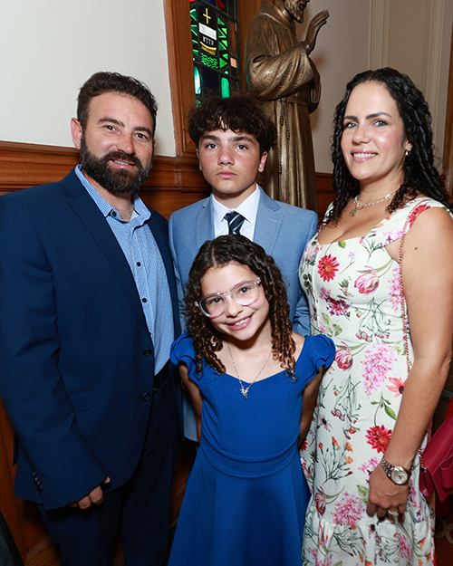 Christopher Asuar (center), a candidate to receive a full Communion with the Catholic Church attended the Rite of Reception at St. Mary Cathedral in Miami May 4, 2025, with his parents, Aleph and Madelyn Asuar, and his younger sister, Melany.
