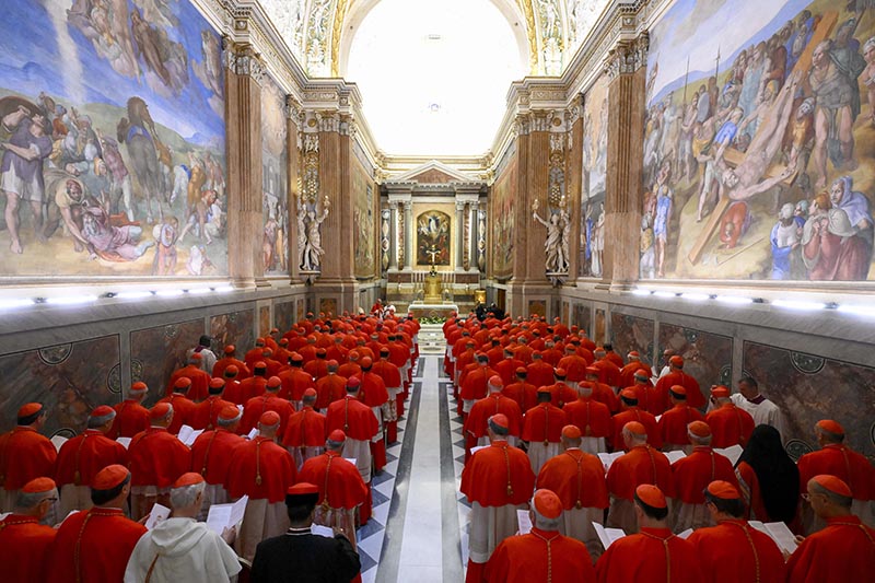 The cardinals gather for prayer in the Pauline Chapel of the Apostolic Palace at the Vatican before processing into the Sistine Chapel to begin the conclave to elect a new pope May 7, 2025.