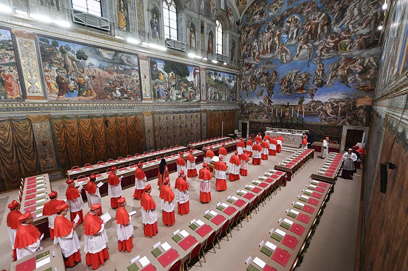 Cardinals process into the Sistine Chapel at the Vatican May 7, 2025, at the start of the conclave to elect a new pope.