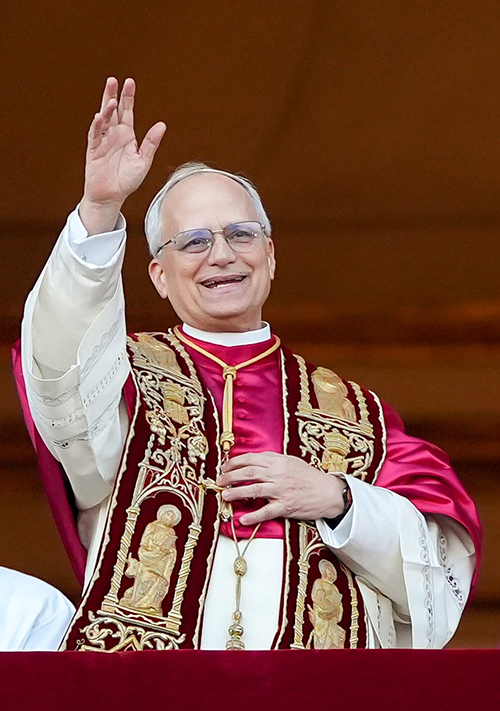 Pope Leo XIV, the former Cardinal Robert F. Prevost, waves to the crowds in St. Peter's Square at the Vatican after his election as pope May 8, 2025. The new pope was born in Chicago.