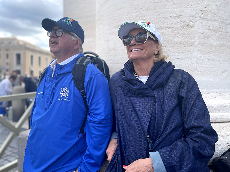 Chuck and Annette Walker, from the Archdiocese of Los Angeles, await smoke near St. Peter's Square on the morning of May 8, 2025. The smoke eventually came, and was black, meaning no pope had been chosen.
