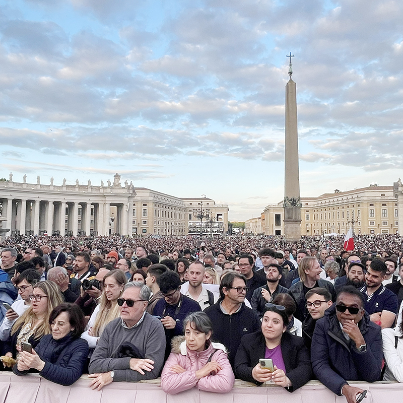 Pilgrims wait for smoke in St. Peter's Square at the Vatican on the evening of May 7, 2025, the first night of the conclave to elect a new pope. The smoke eventually came, and was black, meaning no pope had been chosen.