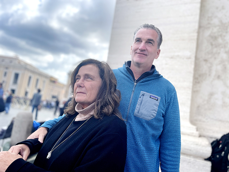 Shane and Sarah Stoner from La Crosse, Wis., await a sign of smoke near St. Peter's Square in Rome May 8, 2025. The smoke eventually came, and was black, meaning no pope had been chosen.