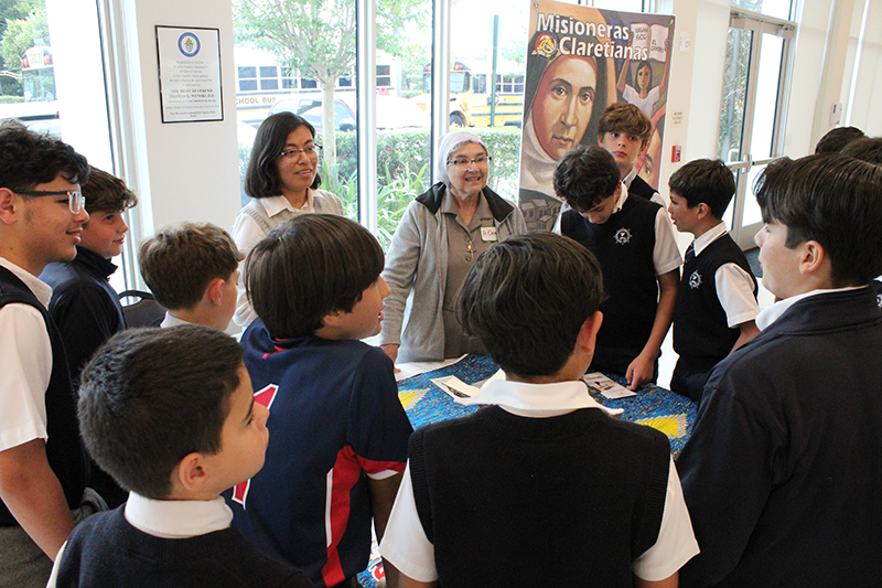 Claretian Missionary Sisters Lizeth Guadalupe Manrique Musico (center left) and Ondina Cortes (center right) answer questions from sixth grade students from Catholic schools in the Archdiocese of Miami during the Focus 11 Vocations Rally on May 15, 2025 at St. John Vianney College Seminary in Miami.
