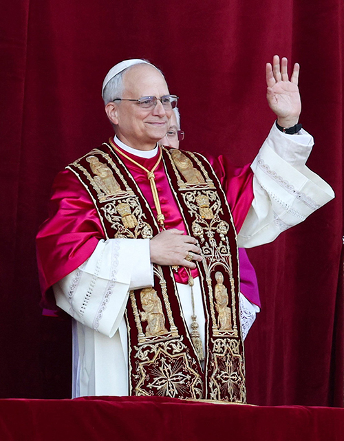 Cardinal Robert Francis Prevost, who has chosen the papal name Leo XIV, appears on the central balcony of St. Peter's Basilica at the Vatican May 8, 2025, following his election during the conclave. He is the first American pope in history.