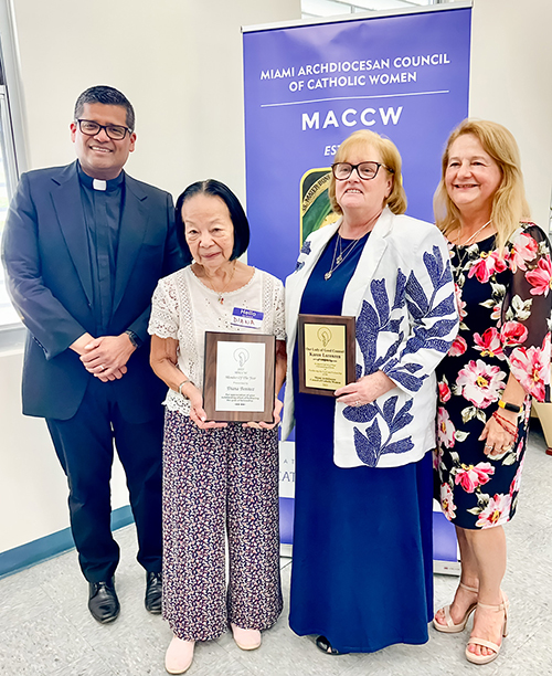 Diane Benitez (left center), awarded Member of the Year, and Karen Lorenzen (right center), honored with the Our Lady of Good Counsel Award, pose with their plaques at the Miami Archdiocesan Council of Catholic Women (MACCW) convention Apr. 26, 2025. Pictured beside them are Father Milton Martinez Blass (far left), archdiocesan director of the Office of Vocations; and Fabiola Sanchez-De Armas (far right), MACCW president.