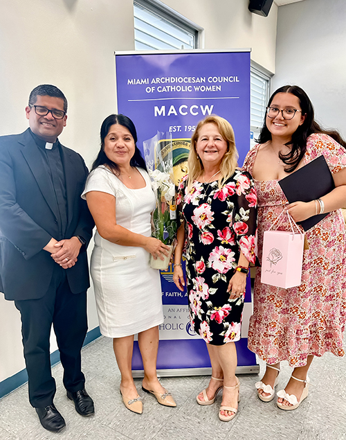 Mia Rodriguez (far right), a senior at Our Lady of Lourdes Academy, smiles for the camera after receiving the Golden Rose Award at the Miami Archdiocesan Council of Catholic Women (MACCW) convention Apr. 26, 2025 at Archbishop Coleman F. Carroll High School in Miami.
Pictured beside Rodriguez are (from left) Father Milton Martinez Blass, archdiocesan director of the Office of Vocations; Ofelia Rodriguez, Mia’s mother; and Fabiola Sanchez-De Armas, MACCW president.