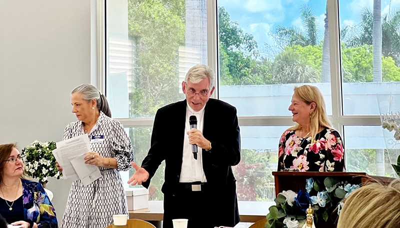 Father Michael Greer (center), spiritual advisor of the Miami Archdiocesan Council of Catholic Women (MACCW), celebrates the 50th anniversary of his ordination at the MACCW convention Apr. 26, 2025 at Archbishop Coleman F. Carroll High School in Miami.