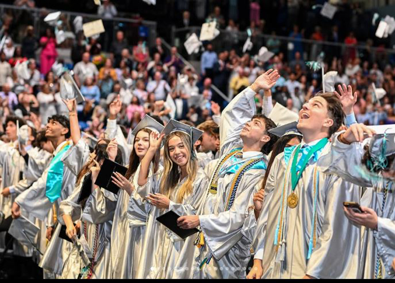 Graduates from Archbishop Edward McCarthy High Class of 2025 celebrate during their commencement ceremony in May. This image was shared on the school's Instagram account @archbishopmccarthyhs.