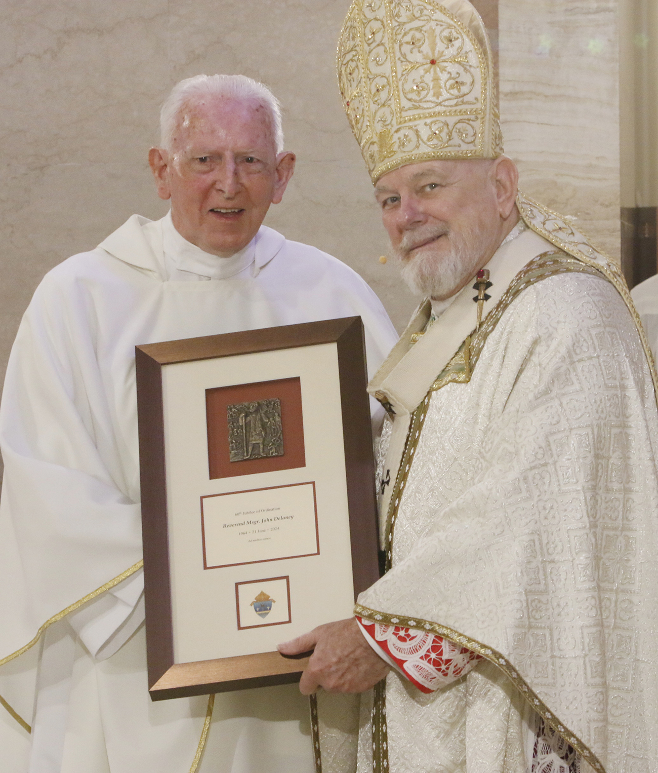 Msgr. John Delaney was congratulated by Archbishop Thomas Wenski on his 60th anniversary in the priesthood March 26, 2024, at St. Mary Cathedral during the Chrism Mass. He died June 30, 2025, in Ireland. Msgr. Delaney served the Archdiocese of Miami for more than four decades.