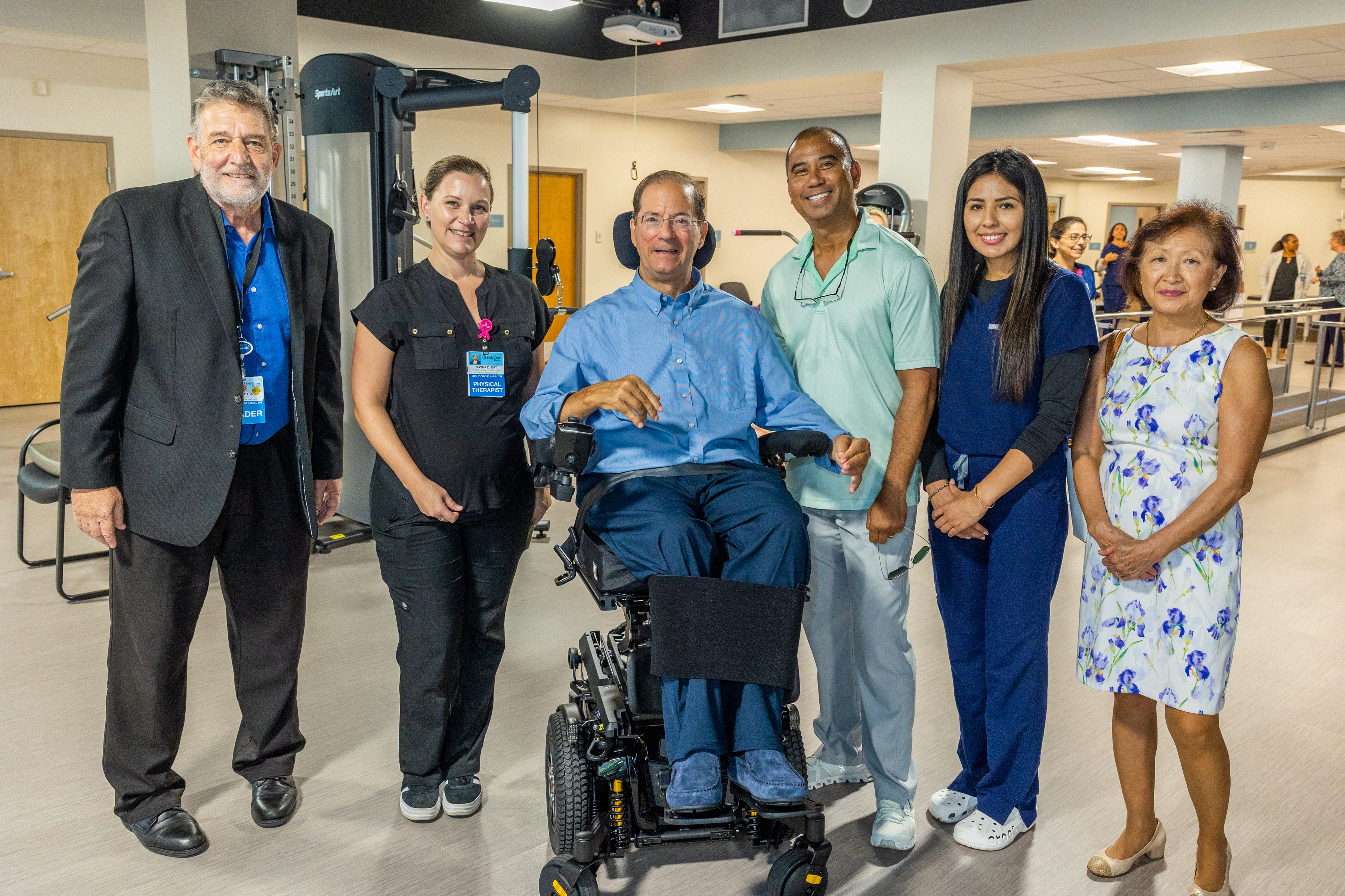 Donors Jon (center) and Helaine Ayers (far right) pose with members of the physical therapy team during the unveiling of the Jon & Helaine Ayers Rehabilitation Center in Fort Lauderdale July 8, 2025.