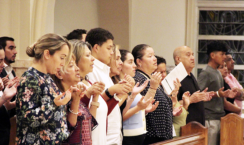 Attendees of the Jubilee of Young People Mass pray July 17, 2025 at St. Mary Cathedral in Miami. Attendees traveled to Rome for the Jubilee of Young People from July 28 to August 3.