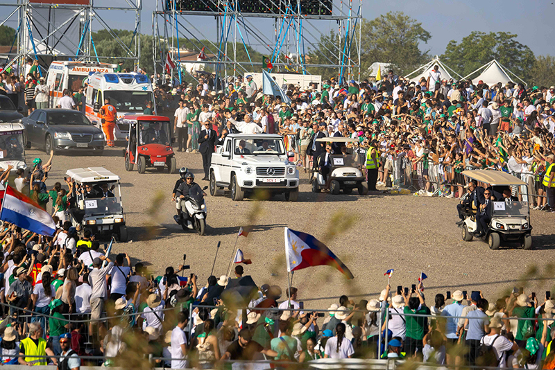 Pope Leo XIV waves to the crowd from the popemobile as he arrives to celebrate the Mass closing the Jubilee of Youth in Rome’s Tor Vergata neighborhood Aug. 3, 2025.