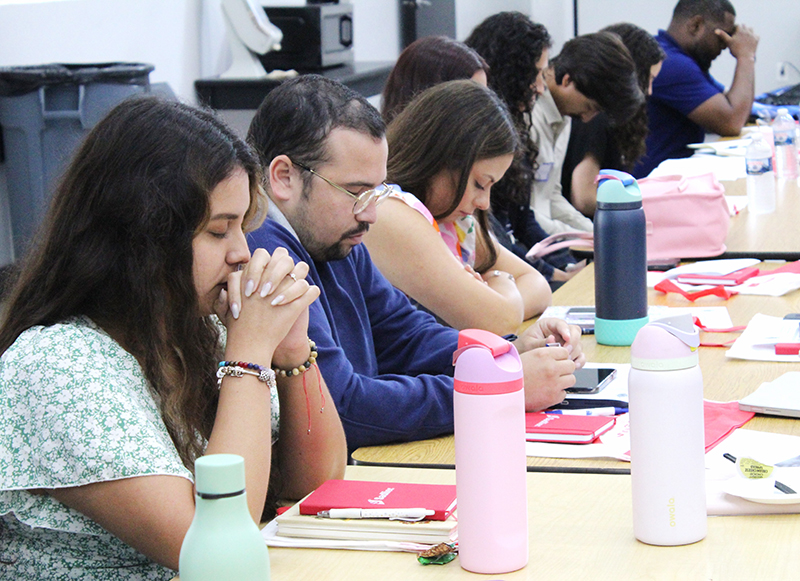 New teachers take a moment to pray and reflect at the New Teacher Orientation on Aug. 4, 2025, held at Monsignor Edward Pace High in Miami Gardens, organized by the Office of Catholic Schools.