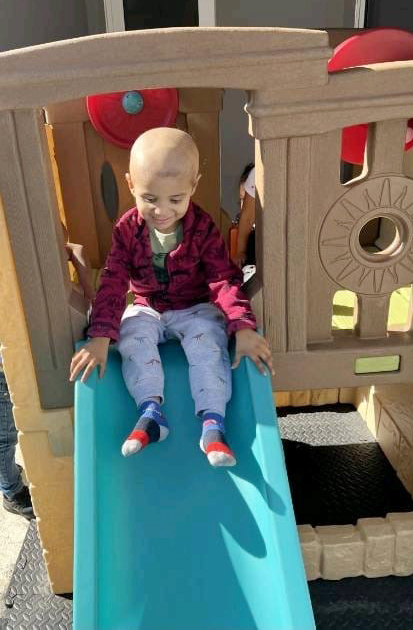 Liam is pictured on the playground in June 2023 at Catholic Charities' Sagrada Familia Child Development Center in Little Havana. He attended the preschool program and received extensive support services.
