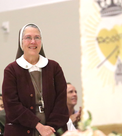 Mother Adela Galindo, foundress of the Servants of the Pierced Hearts of Jesus and Mary, stands at the foot of the altar during a Mass celebrating her 40th anniversary on August 15, 2025 at Our Lady of Guadalupe Parish in Doral.