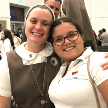 Mariana Mendoza, of Our Lady of Guadalupe Parish in Doral and a member of the Young Apostles of the Servants of the Pierced Hearts of Jesus and Mary, poses with Sister Clare Marie at the conclusion of the 40th anniversary Mass celebrating their foundress, Mother Adela Galindo, on August 15, 2025 at Our Lady of Guadalupe Parish.