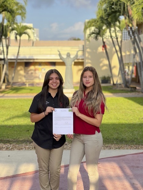 Emilie Alvarez (left) and Angelina Vargas, co-founders of Monsignor Edward Pace High School’s Evergreen Club, obtained a grant to construct a greenhouse and support community food security.