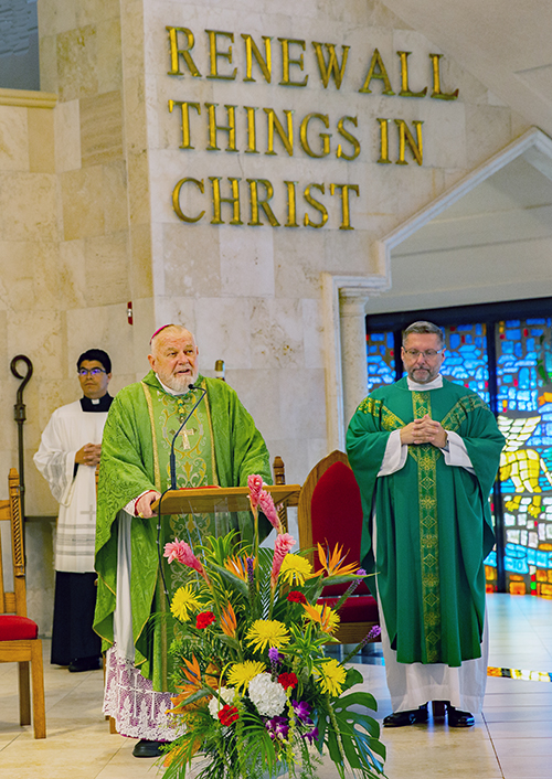 Archbishop Thomas Wenski addresses St. Pius X congregation as Msgr. Dariusz Zielonka looks on during a Mass in which Archbishop Wenski installed Msgr. Zielonka as pastor of the church in Fort Lauderdale Sept. 7, 2025.