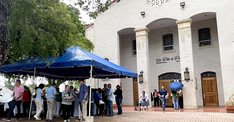 Dozens of parishioners attended the street naming ceremony in honor of Father Juan M. López, pastor of Sts. Peter and Paul Church in Miami for 34 years. Due to persistent rain, the ceremony was held inside the church Sept. 12, 2025.