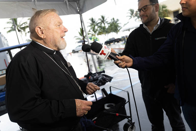 Miami Archbishop Thomas Wenski speaks with the media Sept 8 before celebrating Mass at the The National Shrine of Our Lady of Charity in Miami, speaks with pilgrims before the start of Mass for the annual feast of Our Lady of Charity and the  25th anniversary of La Ermita’s designation as a National Shrine by the United States Conference of Catholic Bishops in 2000.