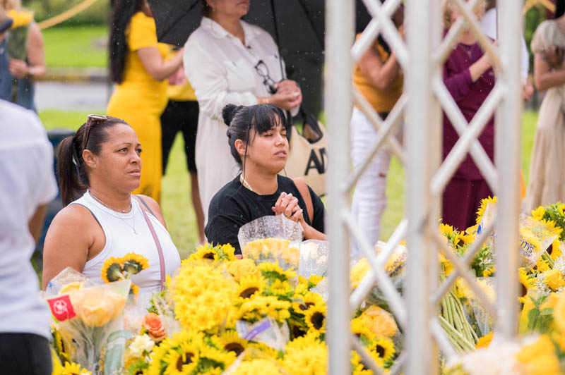 Pilgrims braved heavy rain downpours to place flowers and pray Sept. 8, 2025 at the The National Shrine of Our Lady of Charity in Miami, affectionately known as La Ermita de La Caridad, for the annual feast of Our Lady of Charity and the  25th anniversary of La Ermita’s designation as a National Shrine by the United States Conference of Catholic Bishops in 2000.