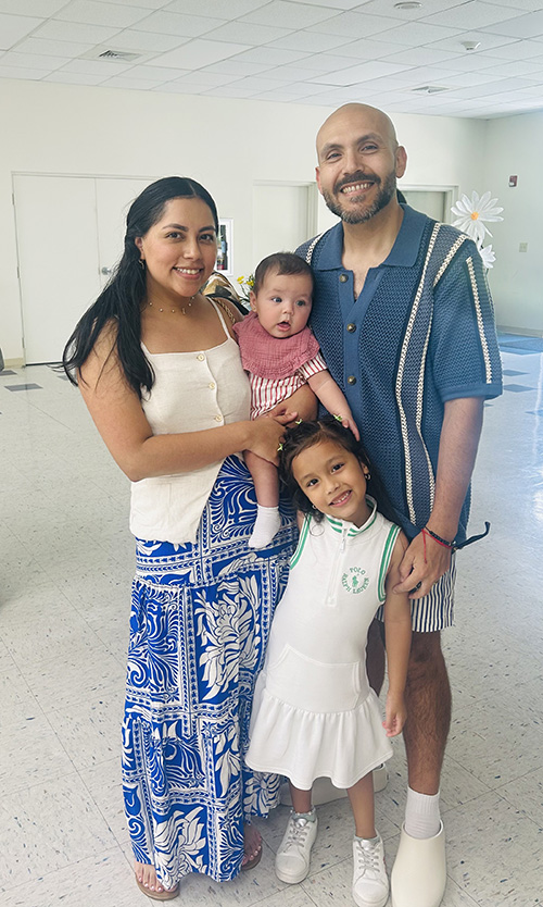 Jennifer and David Saavedra of Cutler Bay, daughter London and 5 month-old baby Leia pose at the grand opening and ribbon cutting ceremony of Holy Rosary St. Richard Preschool in Palmetto Bay on Oct. 5, 2025. Leia attends the new North Campus of HRSR School in Cutler Bay.