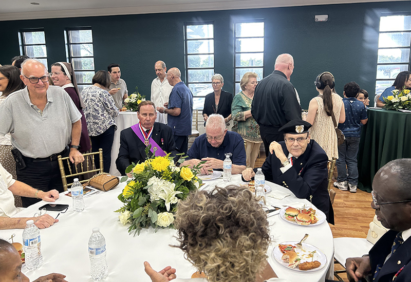 Parishioners and guests of St. David Parish in Davie attended a reception following the installation Mass of Father Ryan Saunders as pastor and the rededication of O'Reilly Parish Hall in honor of founding pastor Father Gabriel O'Reilly, Oct. 12, 2025.