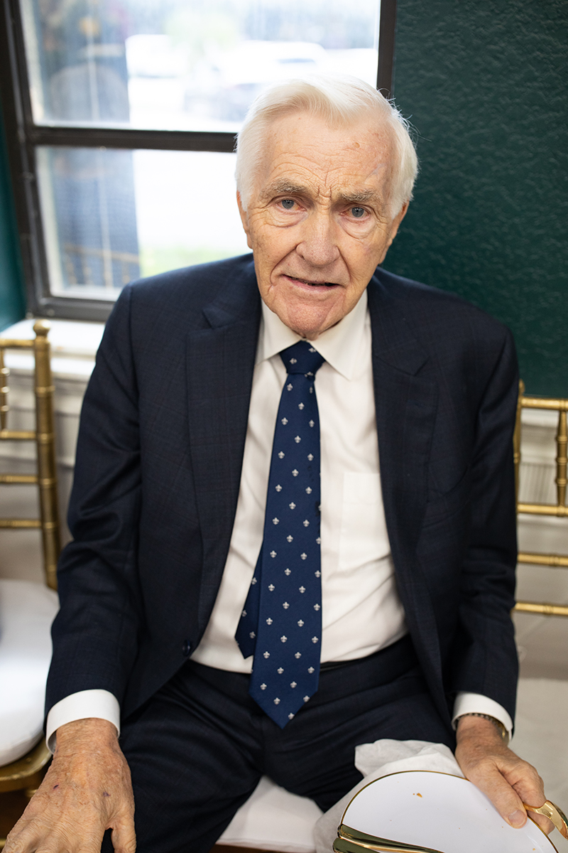Hubert O'Reilly Sr., brother of Father Gabriel O'Reilly, founding pastor of St. David Parish in Davie, poses for a photo during the reception following Mass and the rededication of O'Reilly Parish Hall, Oct. 12, 2025.