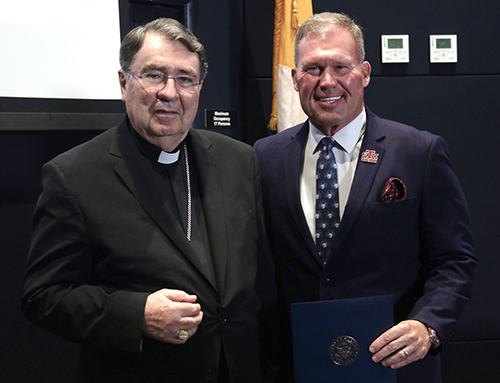 Cardinal Christophe Pierre, left, apostolic nuncio to the U.S., is photographed with David Armstrong, president of St. Thomas University, at the commemoration of the 60th anniversary of Nostra Aetate at St. Thomas University in Miami Gardens, Oct. 20, 2025.