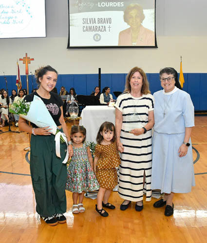 Marisa Camaraza Avello and her family pose with Sister Carmen Fernandez, president of Lourdes Academy, after accepting a Legacy of Lourdes Award on behalf of her stepmother, Silvia Bravo Camaraza, presented at Our Lady of Lourdes Academy, Miami, on Oct. 5, 2025.
