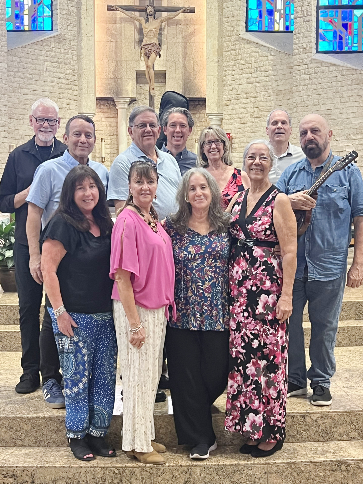 Wesley B. Wright, pictured here holding his mandolin, poses with other members of the St. Bonaventure Folk Music Ministry in Davie, Florida, after performing at the 5:30 p.m. Saturday Vigil Mass, Oct. 19, 2024. Wright has been a member of St. Bonaventure's folk music group for 30 years.