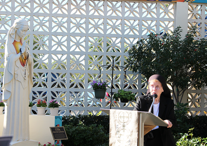 Sister Elizabeth Worley, chancellor for administration and chief operating officer of the Archdiocese of Miami, speaks at the St. Thomas Aquinas High School Prayer Garden dedication Oct. 23, 2025. The Fort Lauderdale high school's Prayer Garden recognizes Sister Worley and the archdiocese's women religious whose prayers and service have strengthened Catholic education in the Archdiocese of Miami.