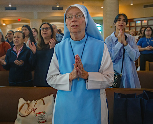 Sister Mary Rose, of the Daughters of Mary from New Hampshire, prays during a Mass at St. Mark the Evangelist Parish in Southwest Ranches celebrated as part of the Archdiocese of Miami Catechetical Conference on Oct. 24, 2025. After Mass, Sister Mary Rose led a breakout session for the conference held next door at Archbishop Edward McCarthy High School.