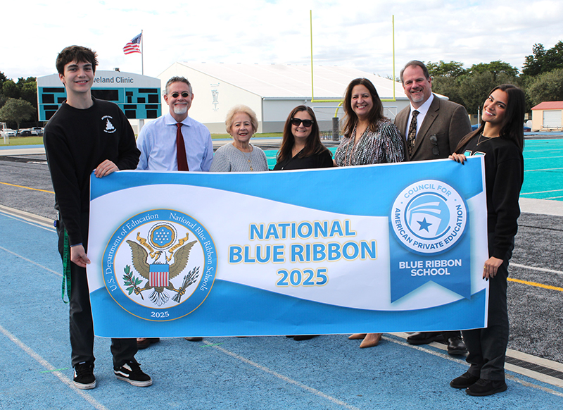 Archbishop Edward McCarthy High School was awarded a 2025 National Blue Ribbon and was the only Catholic high school in Florida to receive the distinction this year. The announcement was made at a school Mass Nov. 13, 2025. In the photo presenting the Blue Ribbon banner, from left: Rodrigo Ramirez, McCarthy High Student Government Association (SGA) president; Patrick Sandoe, McCarthy High academic coordinator; Elsa Torres, director of academics and curriculum; Leanna Rodriguez, academic coordinator; Lourdes Moss, vice principal of instruction; Mark Saxton, vice principal of student affairs; and Darleen Ramirez, McCarthy High SGA executive vice president.