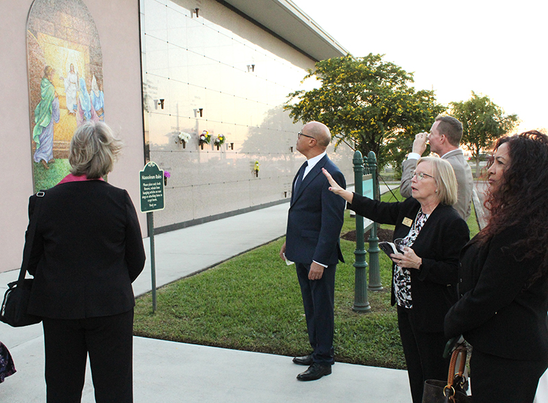 Mary Jo Frick, executive director of Catholic Cemeteries in the Archdiocese of Miami (center right), gives a tour of the Resurrection Mausoleum Complex at Our Lady of Mercy Catholic Cemetery in Doral Nov. 14, 2025.